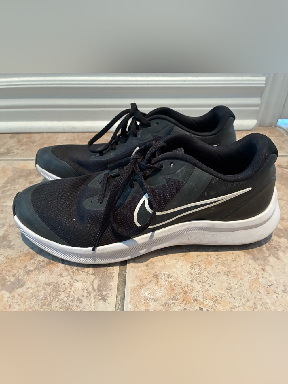 Nike Big Kids/Women's Black Running Shoes with White Swoosh